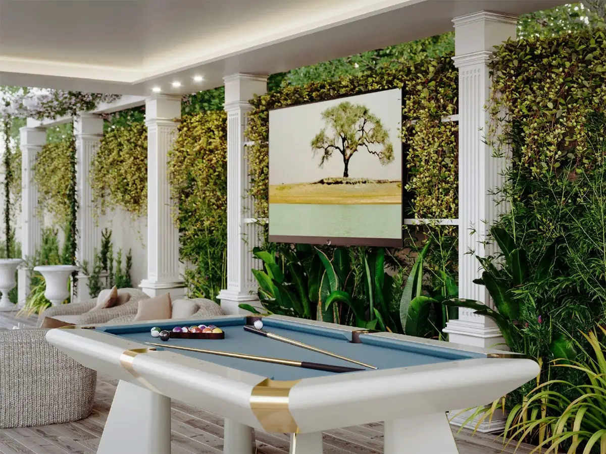 Render del biliardo sotto un portico, fra divani e pareti verdi