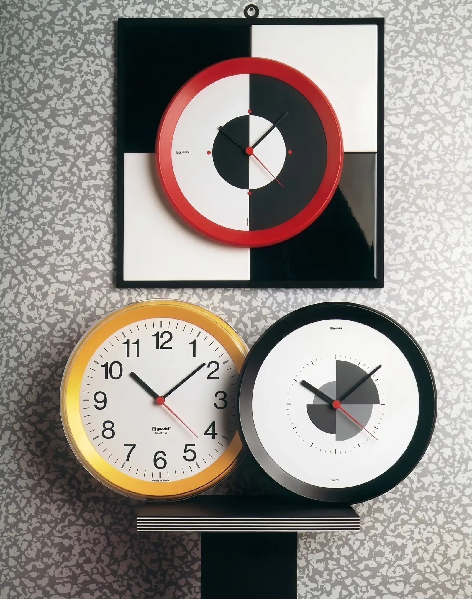 Tre orologi da parete delle serie Cifre e Lune, Fratelli Guzzini